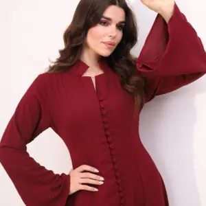 Burgundy maxi dress, elegant modest dress, button detail gown, long sleeve evening dress, formal occasion wear, luxury modest fashion, sophisticated women’s fashion, flowing burgundy gown, timeless elegant dress, wedding guest outfit.