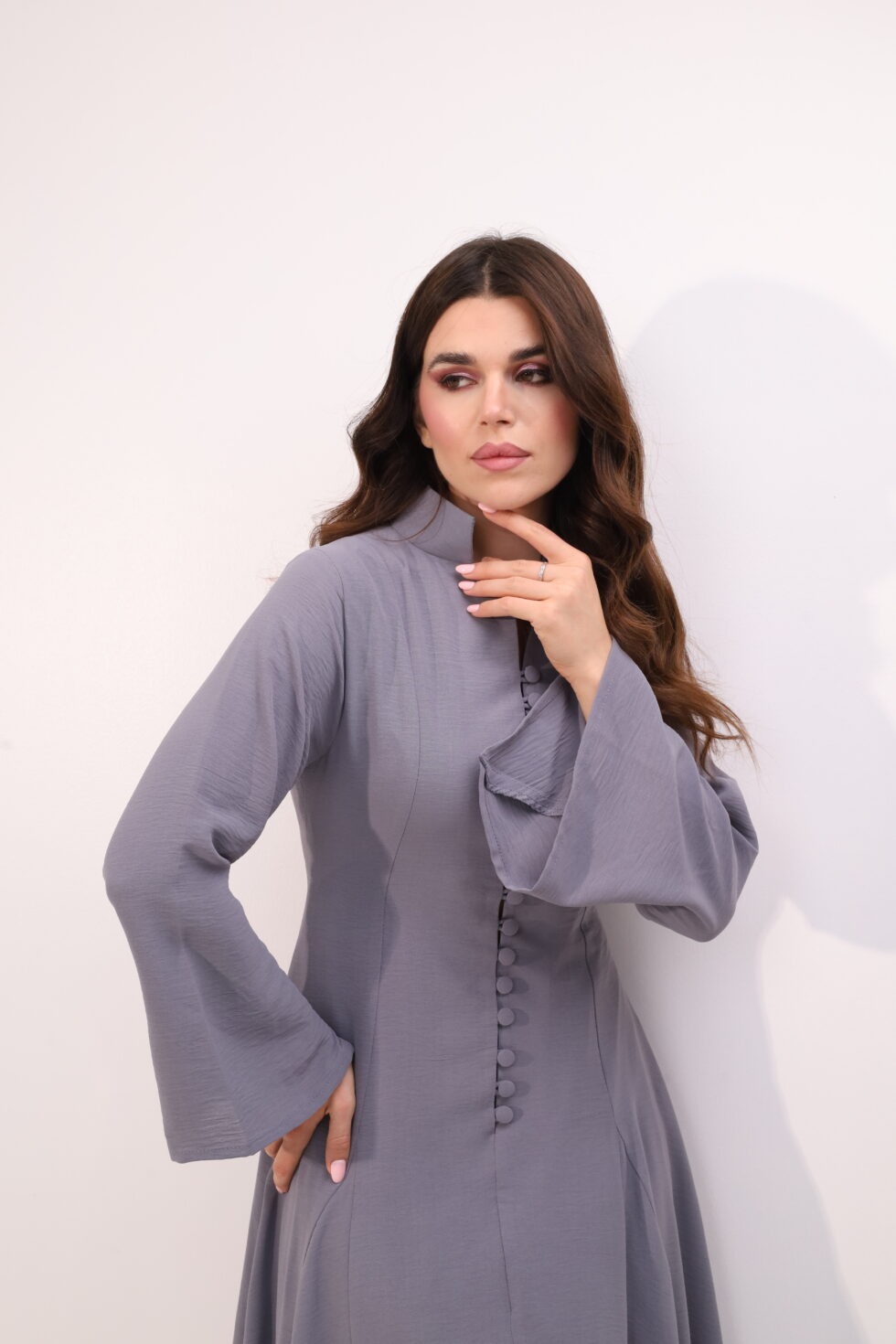 Dusty grey maxi dress, elegant modest dress, button detail gown, long sleeve maxi dress, formal occasion wear, luxury modest fashion, sophisticated women’s fashion, flowing evening dress, timeless grey gown, elegant long dress.